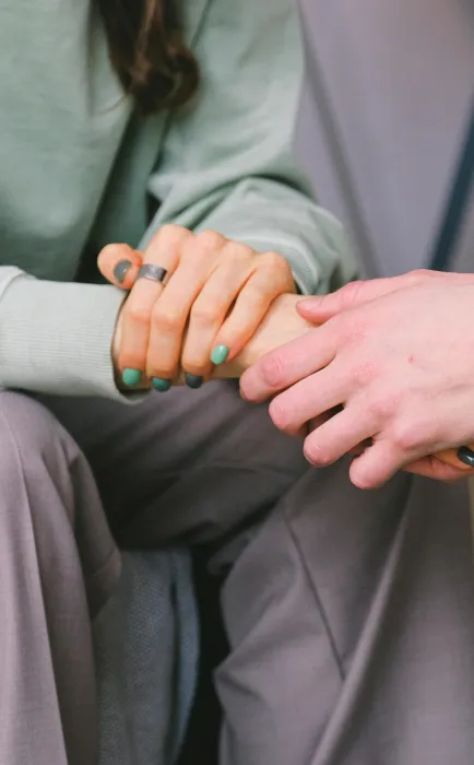 Crop psychologist supporting patient during counseling indoors