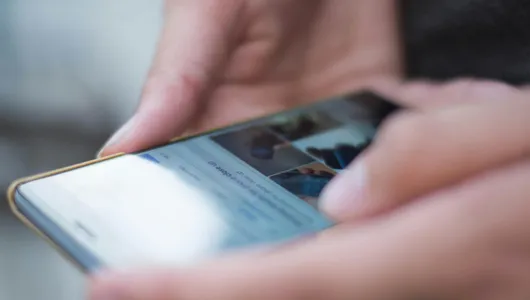 Person Using Smartphone Shallow Focus Photography