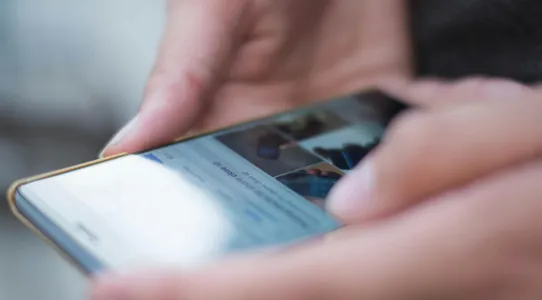 Person Using Smartphone Shallow Focus Photography
