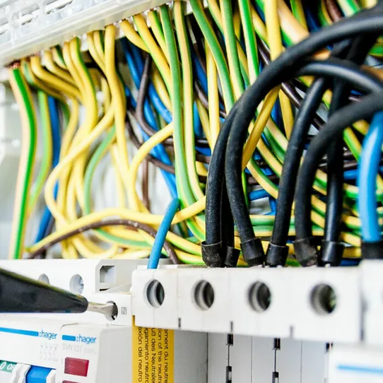 Electrician working on an electric circuit board