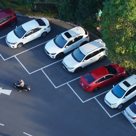 Overhead view of car park with painted bays