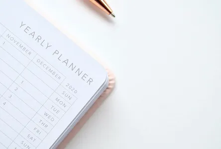 A stylish yearly planner open to a 2020 calendar