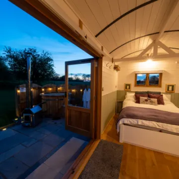 Overwater Luxury Glamping Hodnet Interior Looking Out to the Hot Tub 1