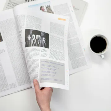 Person Holding White Printer Paper