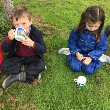 Enjoying a mug of milk at the farm