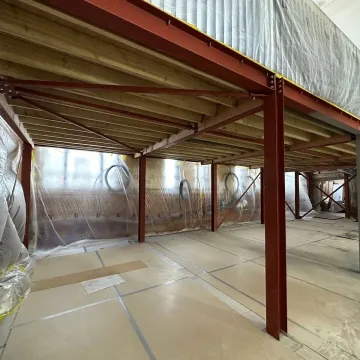 Warehouse interior with red steel columns