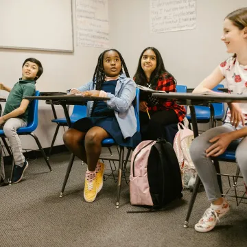 A diverse group of students attentively participat