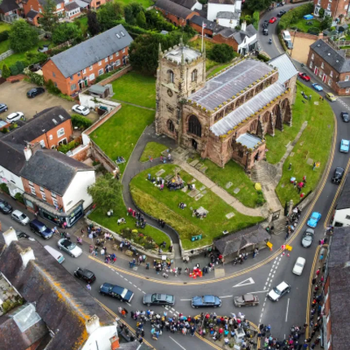 Aerial View Of Vehicle Parade Passing St James 39  Church In Audlem