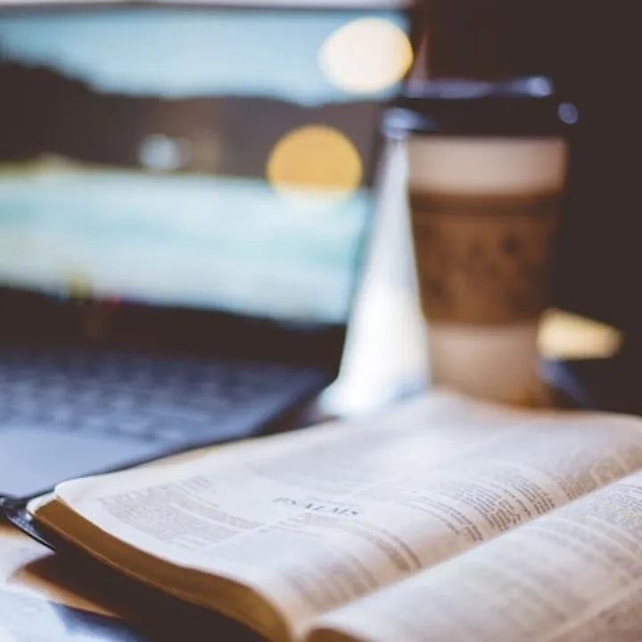 Closeup shot of an open bible with a blurred