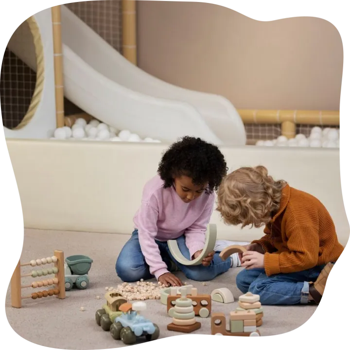 Full shot kids playing with eco toys indoors