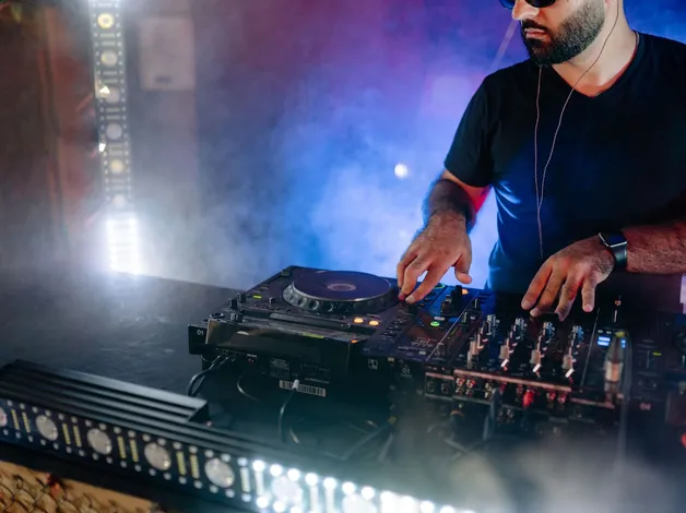 Resident DJ at work in the haze