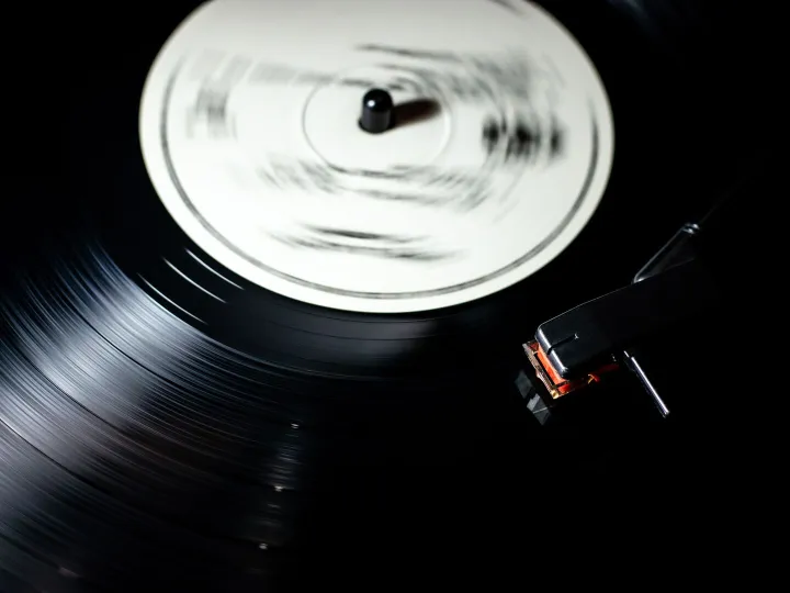 Close-up of a vintage vinyl record spinning on a