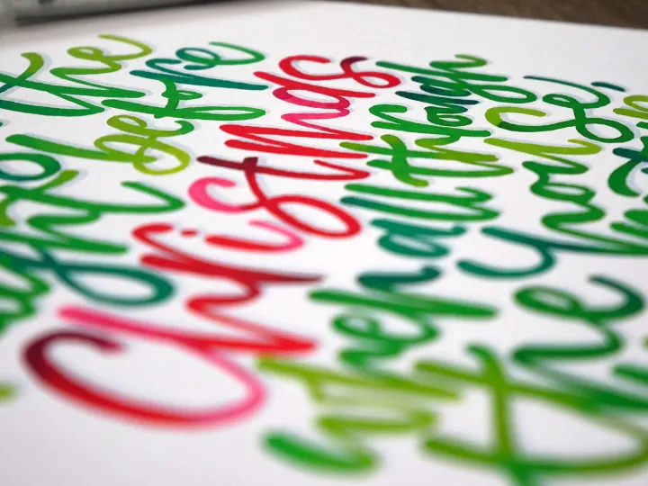 Chruistmas hand lettered in green and red brush pen
