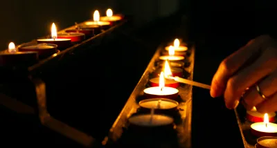 Lighting candles in church