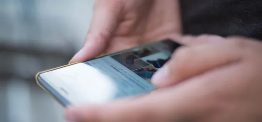 Person Using Smartphone Shallow Focus Photography