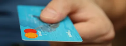 Person Holding Debit Card