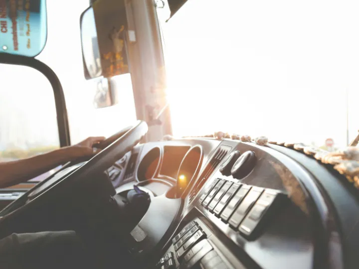 Person Hand On Steering Wheel