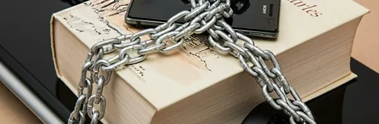 Black Android Smartphone on Top of White Book