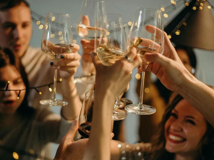 A group of friends joyfully toasting with
