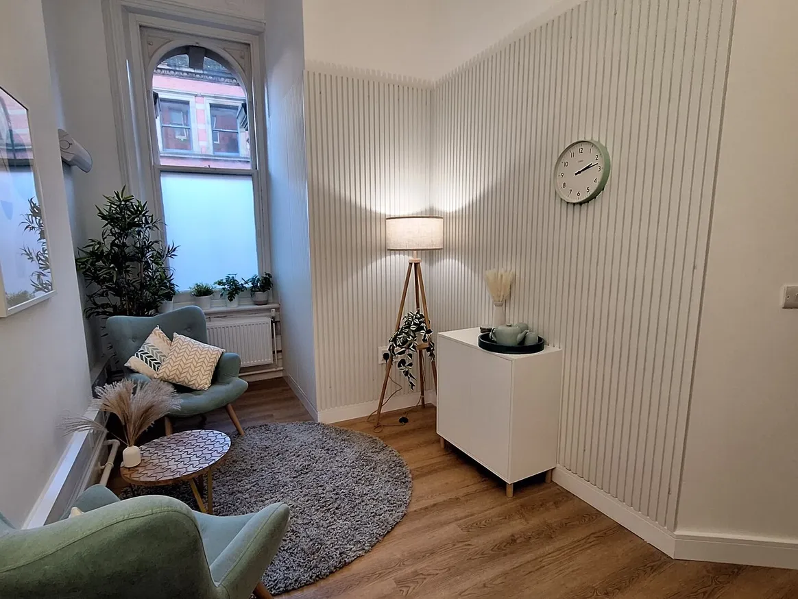 Manchester therapy room with an armchair by the window
