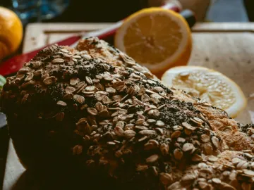 Close-up of rustic bread with oat toppings and
