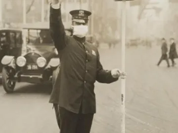 Medical_Department_-_Influenza_Epidemic_1918_-_Masks_for_protection_against_influenza-_Traffic__cop__in_New_York_City_wearing_gauze_ (2)