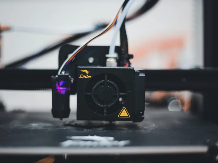 Detailed view of a 3D printer nozzle during the pr