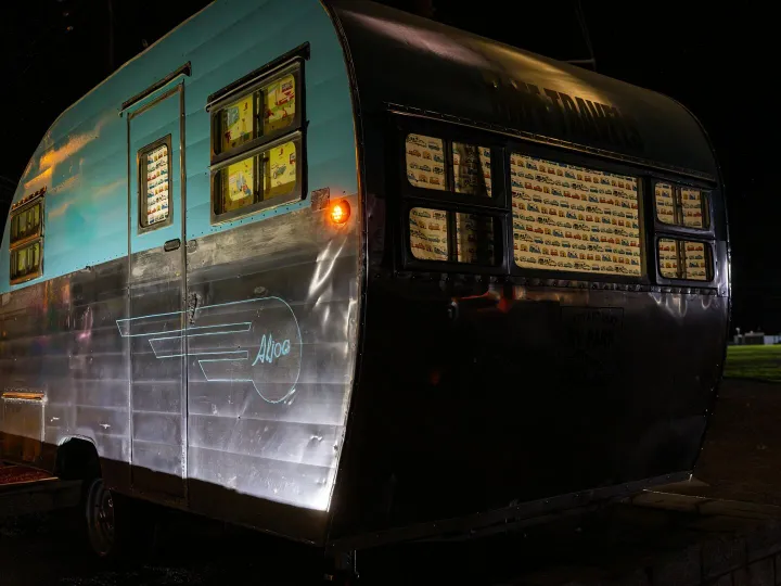A vintage aqua and silver aluminum travel trailer 