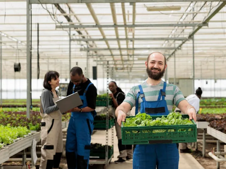Busy group of farmers in modern entrepreneurial bio agricult