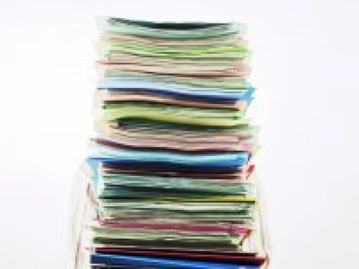 Businessman Carrying Pile of Files