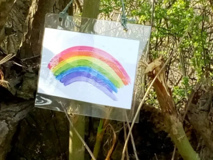 Rainbows made by a member hung around a local hamlet