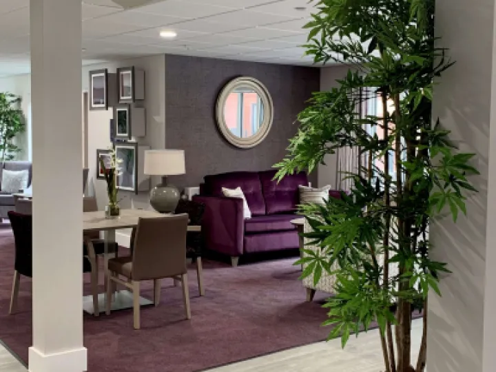 Lounge with purple chairs and mirror