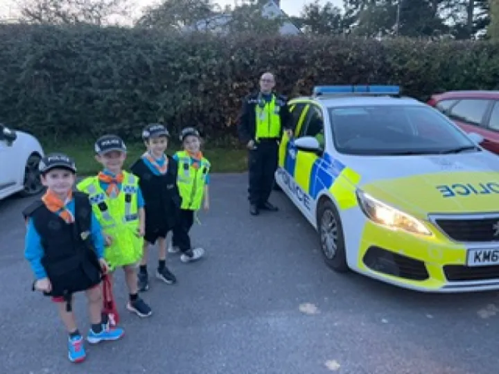 Beavers outside police car Oct 2023 Photo 2023 10 09 20 28 50