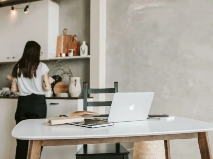 Woman Standing Near The Kitchen Counter With Her L