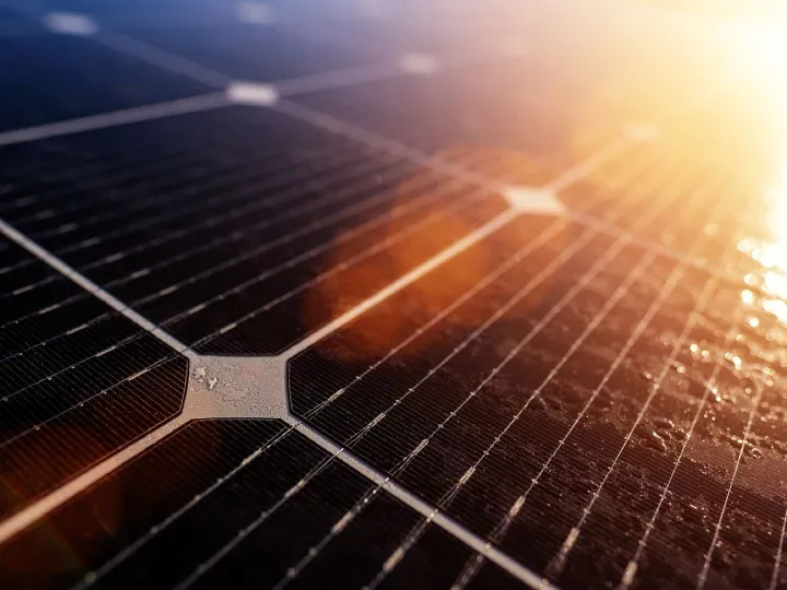 A close up of a solar panel generating electricity from the sun