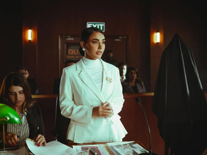 Confident professional woman stands in a courtroom